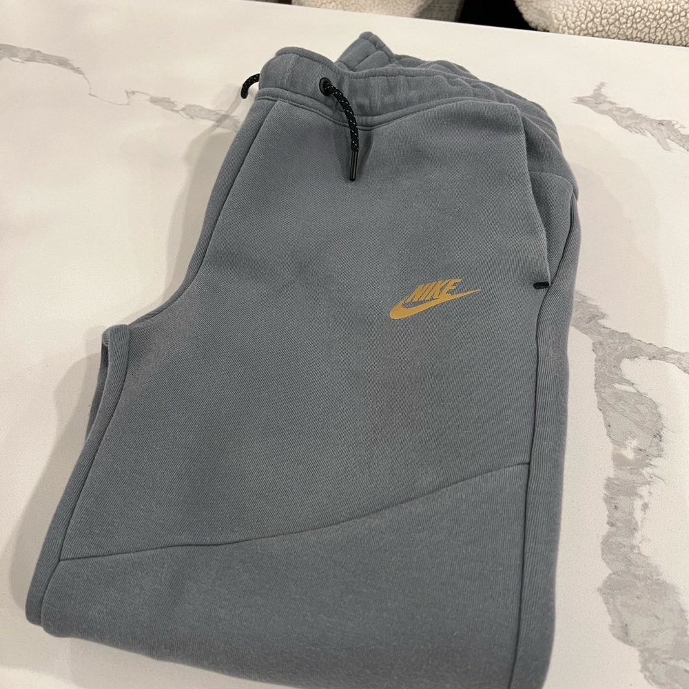 Nike Gray Joggers with Gold Swoosh